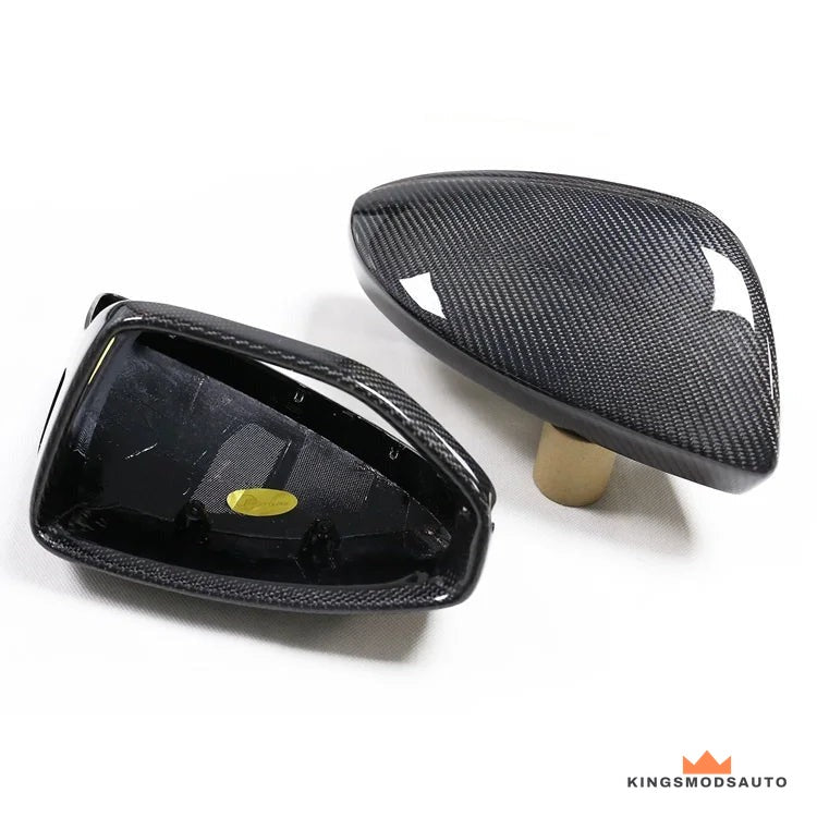 Close-up of the twill carbon weave and gloss clear coat on the mirror cap