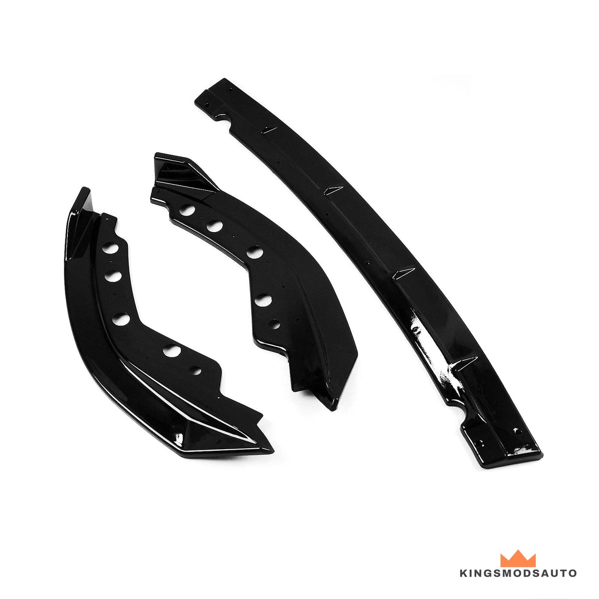 All three pieces of the front lip kit separated: two side extensions and one centre section in gloss black