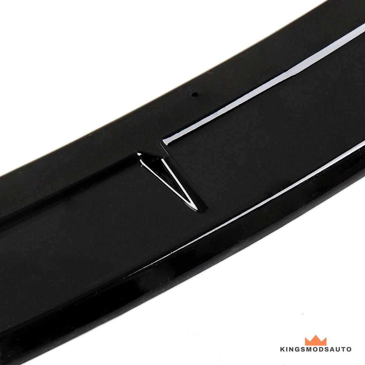 Close-up of the gloss black finish and the sculpted V-shaped detail on the centre section of the lip