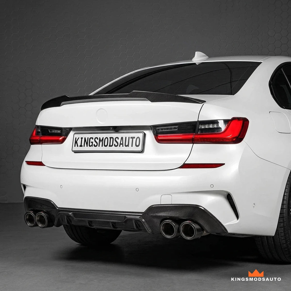 M4-style carbon trunk spoiler fitted on a white BMW G20 3 Series