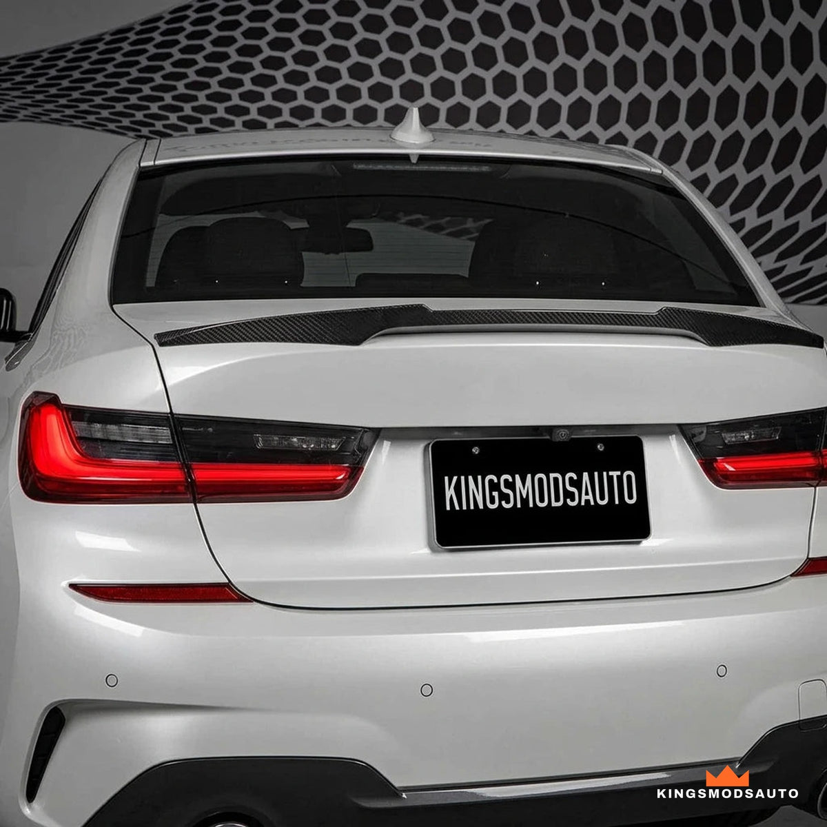 Rear view of a BMW G20 with the dry carbon M4-style trunk spoiler