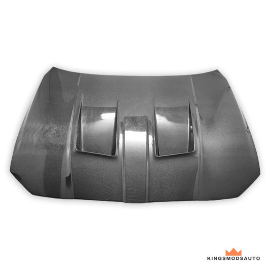 Carbon fiber vented hood for the BMW G80 M3 and G82 M4, top view showing the twin heat-extraction vents